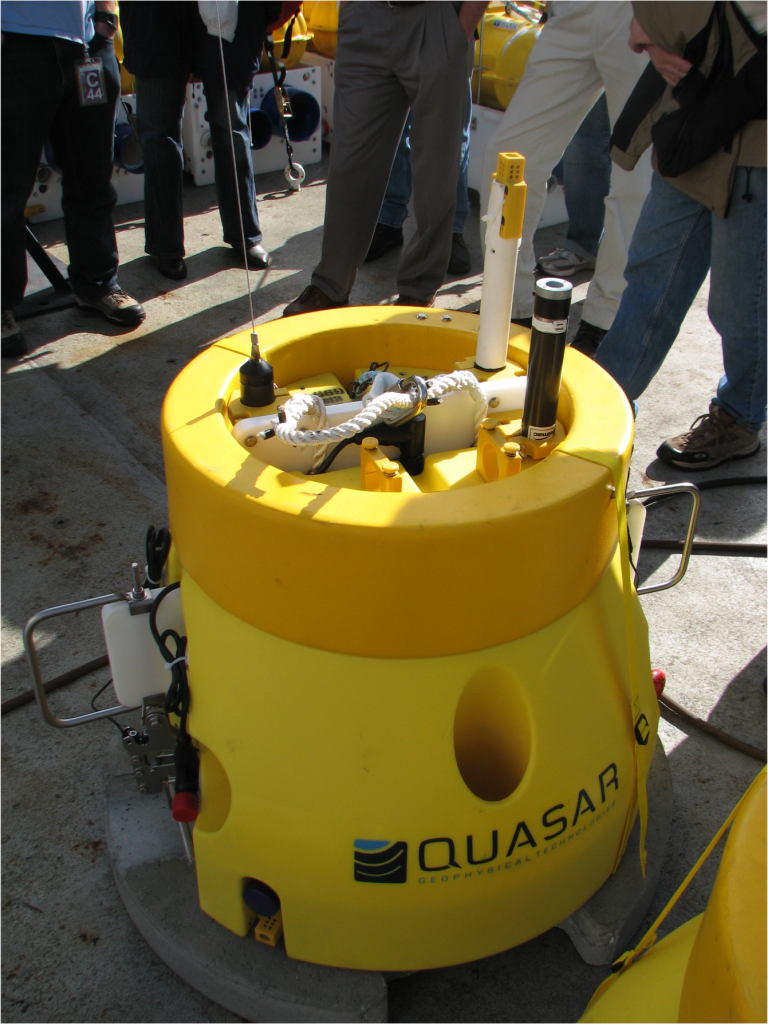 Quasar’s low noise MCSEM receiver. Quasar Geophysical Technologies took an  underwater sensor they developed for the U.S. Navy and redesigned it for ocean bottom surveying with its QMax EM3 underwater electromagnetic receiver (Quasar, 2012). It is the only ocean bottom CSEM receiver to contain all six electric and magnetic components. This image was obtained aboard the Scripps Institution of Oceanography’s ship, R.V. Roger Revelle, 2008.